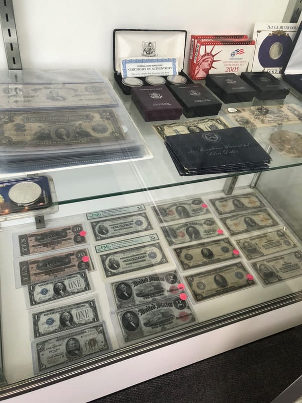 Rows of collectible coins in holders