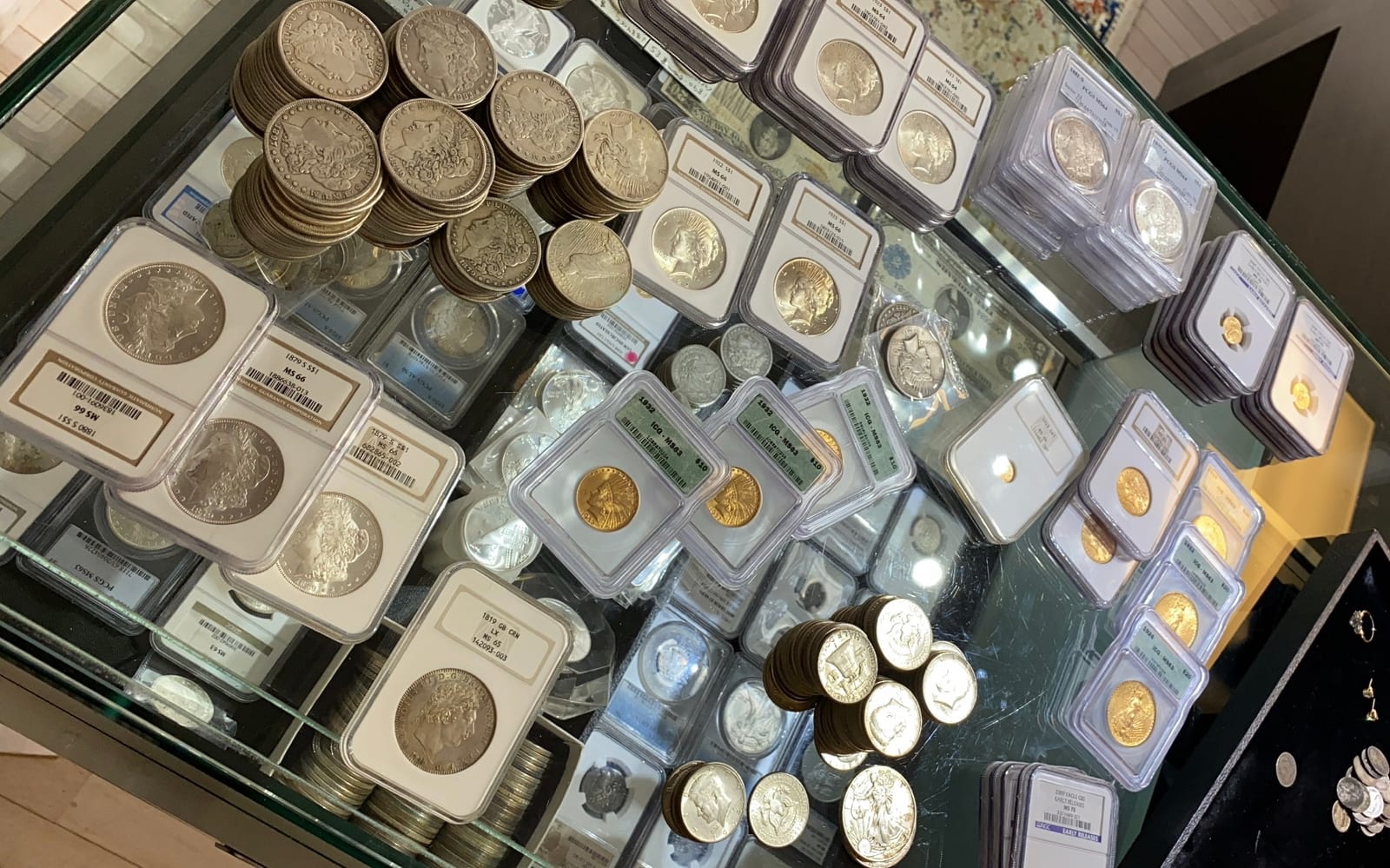 Display case with paper currency and coin sets